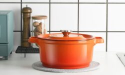 orange plastic container on white table